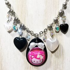 This Is A Tarina Tarantino X Hello Kitty Punk Black & Hot Pink Puffy Pigtail Cameo, Full Multi Beaded Crystal, Puffy Heart Pink & Black Lucite, Dangle Style, Silver Chain Cluster Statement Necklace 16" (+2” Additional Chain Extender) 18” Total Length. Guaranteed Authentic With Signature Designer Metal Stamped Tag (See Pictures For Details) * Item: Tarina Tarantino X Hello Kitty Punk Black & Hot Pink Puffy Pigtail Cameo, Full Multi Beaded Crystal, Puffy Heart Pink & Black Lucite Statement Necklace 16" (+2” Additional Chain Extender) 18” Total Length * Collection Name: Hello Kitty Sanrio By Famous Celebrity Jewelry Designer Tarina Tarantino * Total Measurements: 16” Chain Length & Heart Crystal Necklace, Hello Kitty Black, Stamp Tag, Tarina Tarantino, Celebrity Jewelry, Iridescent Crystal, Black Hot Pink, Chain Extenders, Puffy Heart