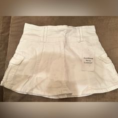 This Is A Brand New Skirt No Flaws. It States That It’s A Size Small. But It Does Run Very Small, So It Is More Like An Extra Small. Have A Cute Little Flair On The Bottom And Shorts Underneath. Super Cute. White High Waist Y2k Mini Skirt, Fitted Cotton Skirt With Built-in Shorts, Casual Mini Skirt With Built-in Shorts For Spring, Y2k High Waist Cotton Skort, Casual Short Lined Mini Skirt, Trendy Fitted Shorts With Pockets, Y2k Style Stretch Cotton Skort, Casual Lined Mini Skirt, Casual High Waist Mini Skirt With Built-in Shorts