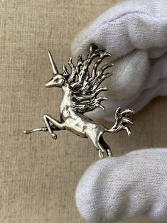 Incredibly Rare Vintage Signed Piece by Artist Carl Tasha (1943-2006). Art Nuevo Modernist Brutalist Figural Sterling Silver Unicorn pendant. Circa 1970s. Very Likely a One-Off or Special Edition by the artist. 2 x 2 inches  Weighs 14.4 grams  Signed on Underbelly Tested as 925 sterling silver Sterling Silver Chain can be added upon request (based on availability) for an additional cost. Want to make an offer? Message me!  Shopping vintage is a great way to conserve resources and help protect th Art Nuevo, Unicorn Tattoos, Unicorn Jewelry, Unicorn Illustration, Unicorn Pendant, Vintage Shopping, Unicorn Art, Art Nouveau Jewelry, Trendy Earrings