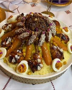 a dish with carrots and other food items on it