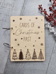 a wooden christmas card with the words cards of christmas past on it