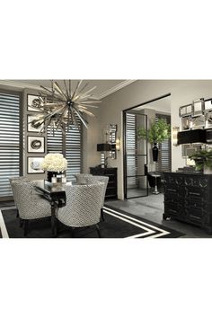 an elegant dining room with black and white decor