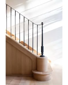 an image of a stair case with railings on the bottom and handrail above it