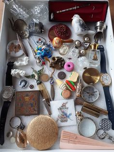 a drawer filled with lots of different types of jewelry and other things to put in it