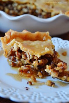 a slice of pecan pie on a white plate