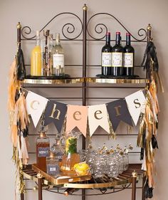 a bar cart filled with liquor bottles and decorations