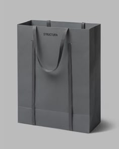 a gray shopping bag with the word structura on it's side