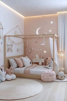 a child's bedroom decorated in pink and white with teddy bears on the floor