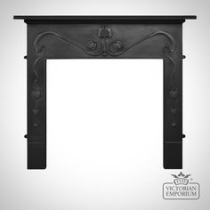 an ornate fireplace surround with black paint and decorative carvings on the top, in front of a white background