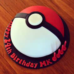 a birthday cake with a pokeball design on it