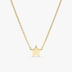 Capella A night sky’s dream. Add a touch of celestial magic to your everyday style with this dainty Mini Star Necklace, crafted entirely in solid gold. This dainty piece features a tiny, gleaming star pendant suspended on a shimmering chain, catching the light with every movement. Wear it on its own for a whisper of understated elegance or layer it with other necklaces for a bolder, personalized look. - Handmade- Solid Gold- Star Size: 8 mm All pieces come beautifully boxed in suede pouches you can always use when traveling! Dainty Star-shaped Yellow Gold Jewelry, Dainty Yellow Gold Star Jewelry, Delicate Yellow Gold Star Jewelry, Minimalist Yellow Gold Star Necklace, Delicate 14k Gold Jewelry With Star Charm, Minimalist Yellow Gold Jewelry With Star Charm, Gold Dainty Necklace, Memory Ring, Gold Star Necklace