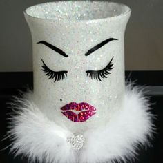 a white vase with glitter on the face and eyelashes