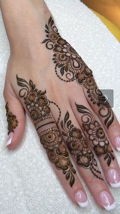 a henna tattoo is shown on someone's hand