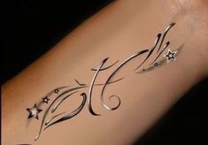 a woman's arm with stars on it and the word hope written in cursive writing