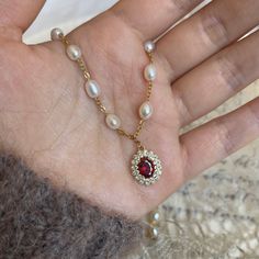 Chain choker with 4-5 mm natural freshwater pearls and 18k gold plating copper-based pendant with red zircon in the middle. All measurements "+3" means 3 cm of extension; for example 38 cm can only be worn at 38 cm, whereas 38+3 cm is adjustable between 38 and 41 cm. Perl Neckles, Jewellery Diy Handmade, Choker Pearl Necklace, Ethereal Jewelry, Red Pendant, Buddha Jewelry, Real Pearl Necklace, Red Pendants, Gold Pearl Necklace