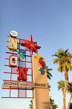 the sign for boneyard park in palm beach, florida is lit up with colorful lights