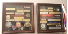 two framed pictures with medals and ribbons on the wall next to each other in front of an american flag