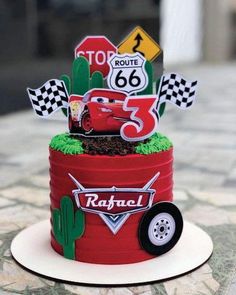 a birthday cake made to look like cars