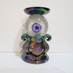 a glass figurine with an eyeball in the center