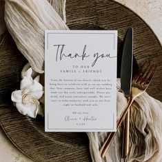 a thank card sitting on top of a plate with silverware and napkins next to it