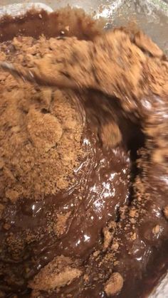 a bowl filled with chocolate and brown batter