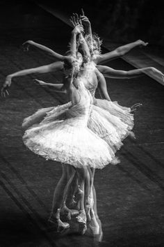 three ballerinas in tutu and leotards