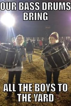 two women are holding drums in front of an audience at a music festival that says, our bass drums bring all the boys to the yard