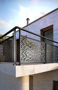 an outdoor balcony with metal railings and decorative screens