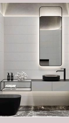 a modern bathroom with black and white decor