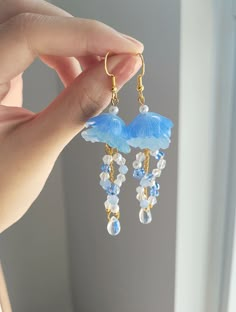 "Add something extra to your outfits with these cute jellyfish earrings! The dangle length is around 7cm/2.7\". It is made with gold wire, shrink plastic, and crystal beads. Each pair is lovingly handmade! 🎀 CARE INSTRUCTIONS 🎀 * Avoid getting your jewelry wet * Avoid perfumes or sprays * Store in a cool, dry place" Shrink Plastic Jellyfish, Jellyfish Earrings Diy, Water Accessories, Jellyfish Jewelry, Jellyfish Earrings, Cute Jellyfish, Shrink Plastic Jewelry, Handmade Jewelry Wire, Sea Earrings