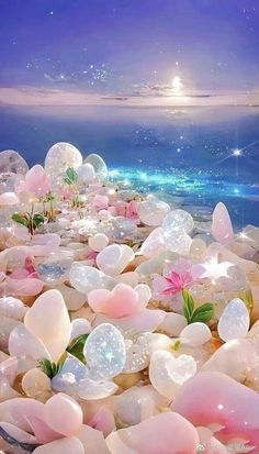 there are many bubbles floating in the water and some flowers on the rocks near the ocean