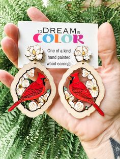 "These handmade Red Cardinal earrings are extremely lightweight and a perfect compliment to any outfit. All my wood earrings are made with Nickle-free, Lead-free, hypoallergenic hooks for your sensitive ears. These earrings are 3\" long. Due to the differences in natural wood, some pieces may have more or less woodgrain and small knot swirls. This is a natural and desired characteristic of wood. I have a variety of colors in this style. Please visit my shop for more. Patterns and textures may va Red Cardinal, Hand Painted Wood, Wood Earrings, Sensitive Ears, Natural Wood, Jewelry Earrings Dangle, Springs, Etsy Earrings, Knot