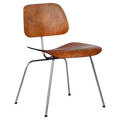 the eames chair is made from wood and metal