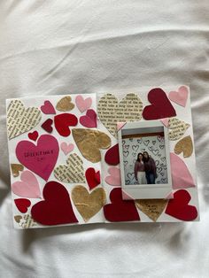 an altered photo frame with hearts on it