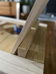 a piece of wood sitting on top of a wooden table