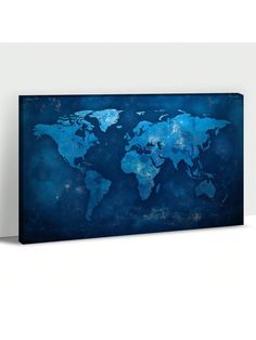 a blue and white world map on a wall