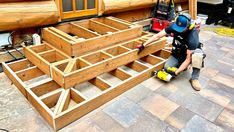 a man is working on some wooden steps