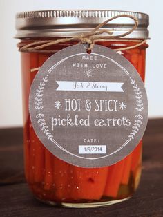 hot and spicy pickled carrots in a mason jar with label on the lid