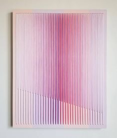 a pink and purple painting on a white wall