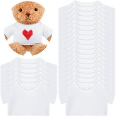 a brown teddy bear wearing a white shirt with a heart on it's chest