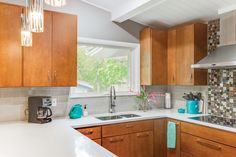 the kitchen is clean and ready for us to use it's appliances, counter tops, and cabinets