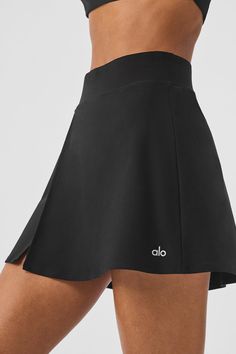 A minimalist version of the fan-favorite Streamlined Skirt, the Backspin matches your moves on- and off-the-court. It has an A-line silhouette that’s swingy in the best way, a fitted waist, and a subtly flared, mid-thigh-skimming hem. A cute side slit shows a little leg as you walk. And if you’d like to make a matching set, may we suggest the Backspin Short Sleeve? Gym Fashion, Athletic Skirt, Tank Top Bras, Womens Capris, Gym Style, Alo Yoga, Sweaters Knitwear, Dream Clothes, Hat Hairstyles