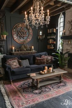 a living room with a couch, coffee table and chandelier hanging from the ceiling