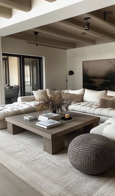 a living room filled with lots of white furniture