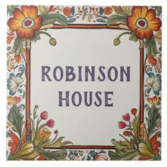 a sign that says robinson house with flowers and leaves on the front, in an ornate frame