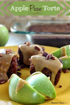 apples with pecans and caramel drizzled on them sitting on a yellow plate