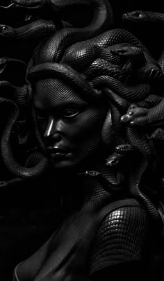 a woman with snakes on her head is shown in black and white, as if she's holding a snake wrapped around her neck