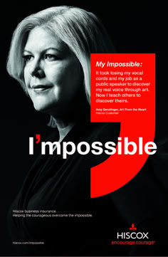 a woman with blonde hair standing in front of a red and black poster that says i'm impossibleible