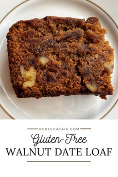 a close up of a piece of cake on a plate with the words gluten - free walnut date loaf