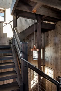 the stairs are made of wood and have metal railings that lead up to them